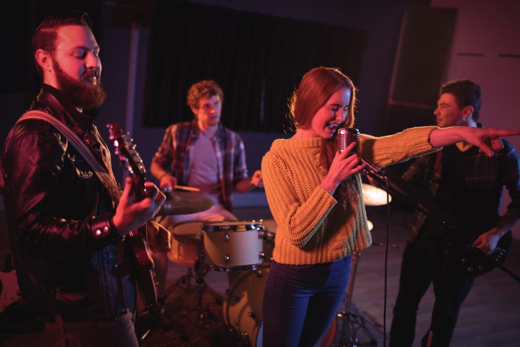 woman singing microphone scaled e1720689063658