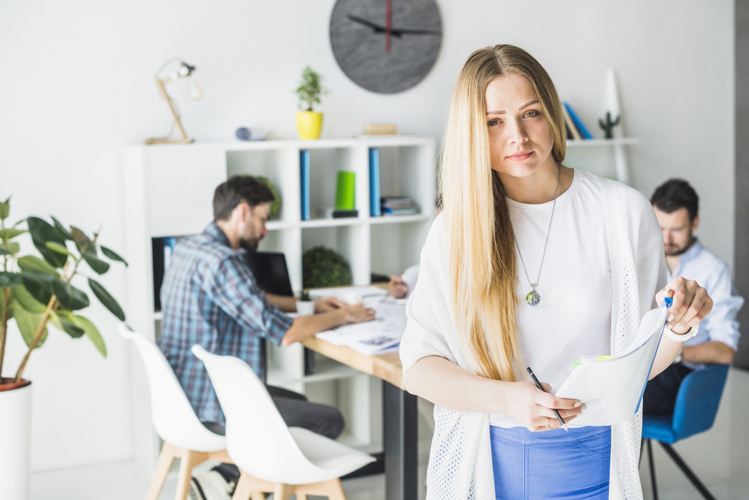 portrait young businesswoman holding folder