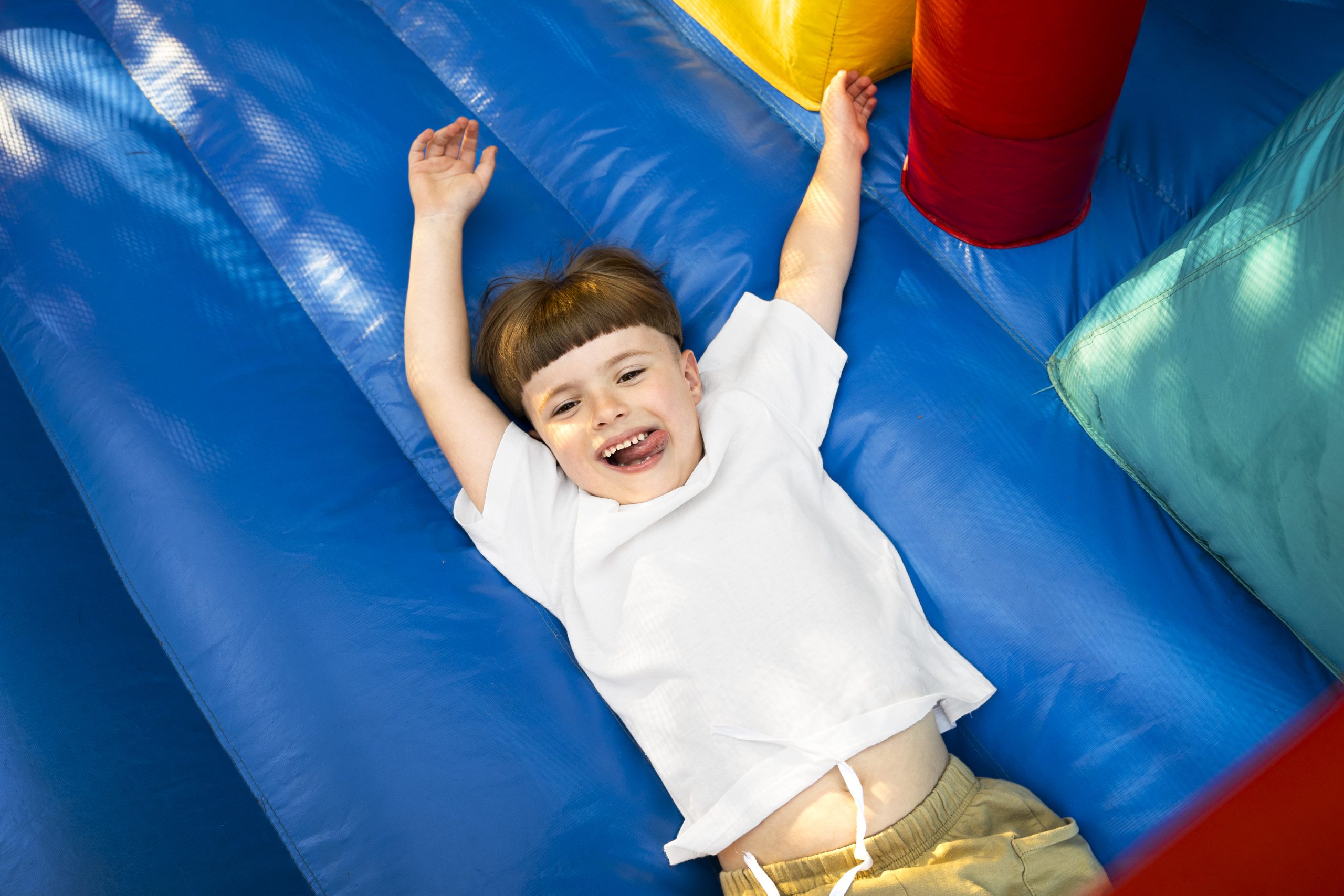 top view kid having fun bounce house